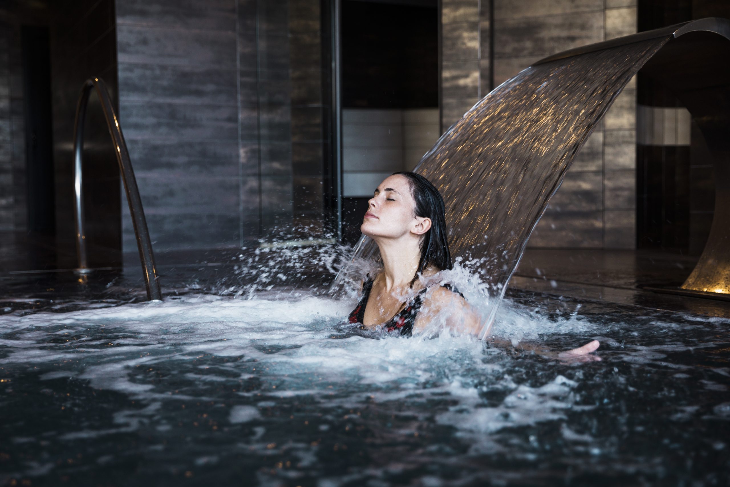 spa-concept-with-woman-relaxing-water